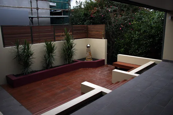 Modern timber deck and raised planters with a bubbler feature